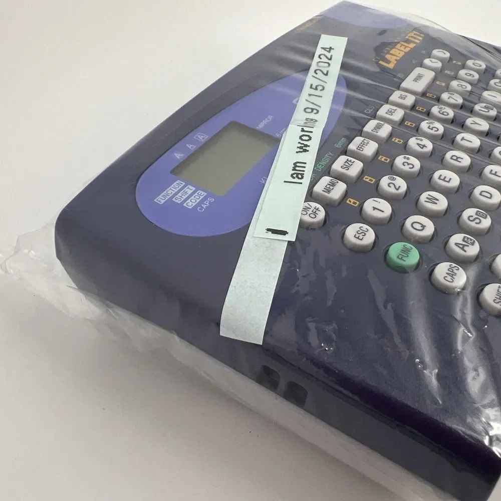 Casio LABEL IT! EZ-Label Printer Model # KL-60-L A Clear Tape Included Inside De